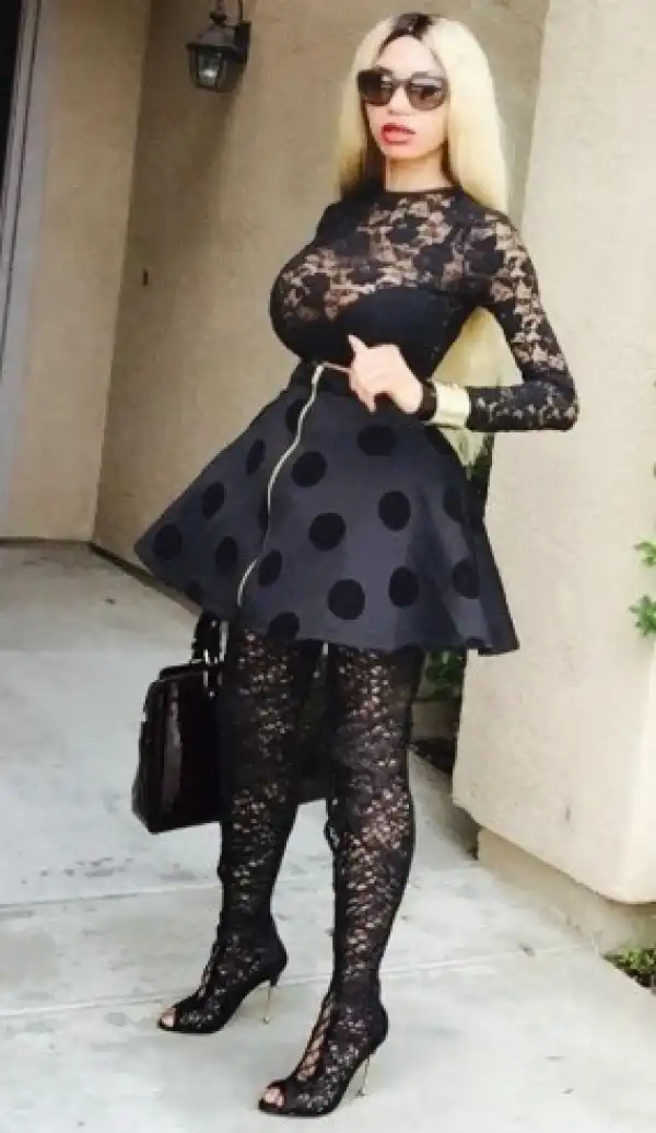 Dencia steps out in lace-up over-the-knee  Tom Ford boots