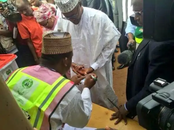 Gen. Buhari and wife doing their accreditation in Katsina