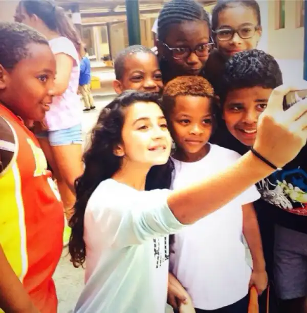 Photo: Friends/fans surround Peter Okoye’s son for a selfie