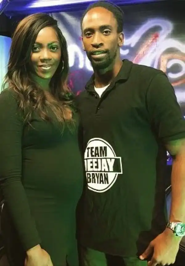 Tiwa Savage flaunts baby bump in Uganda.