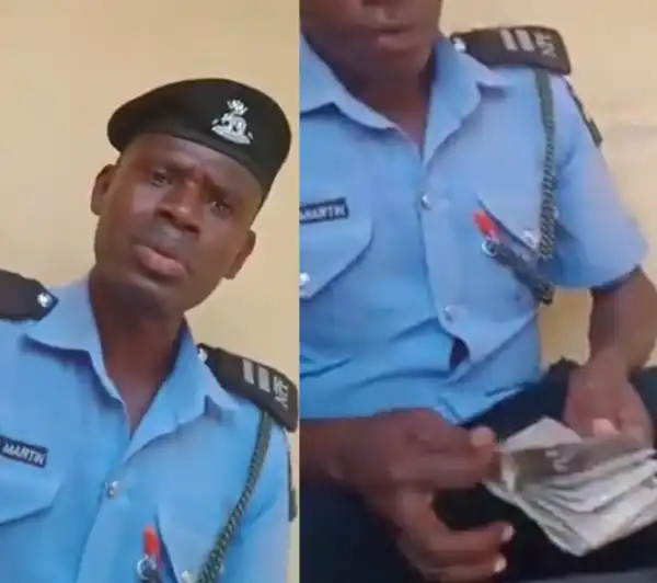 Police officer caught on video counting money after "extorting" 40,000 from a man has been arrested (Watch video)