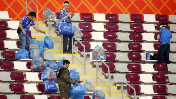 Japan fans clean up stadium after historic World Cup win over Germany