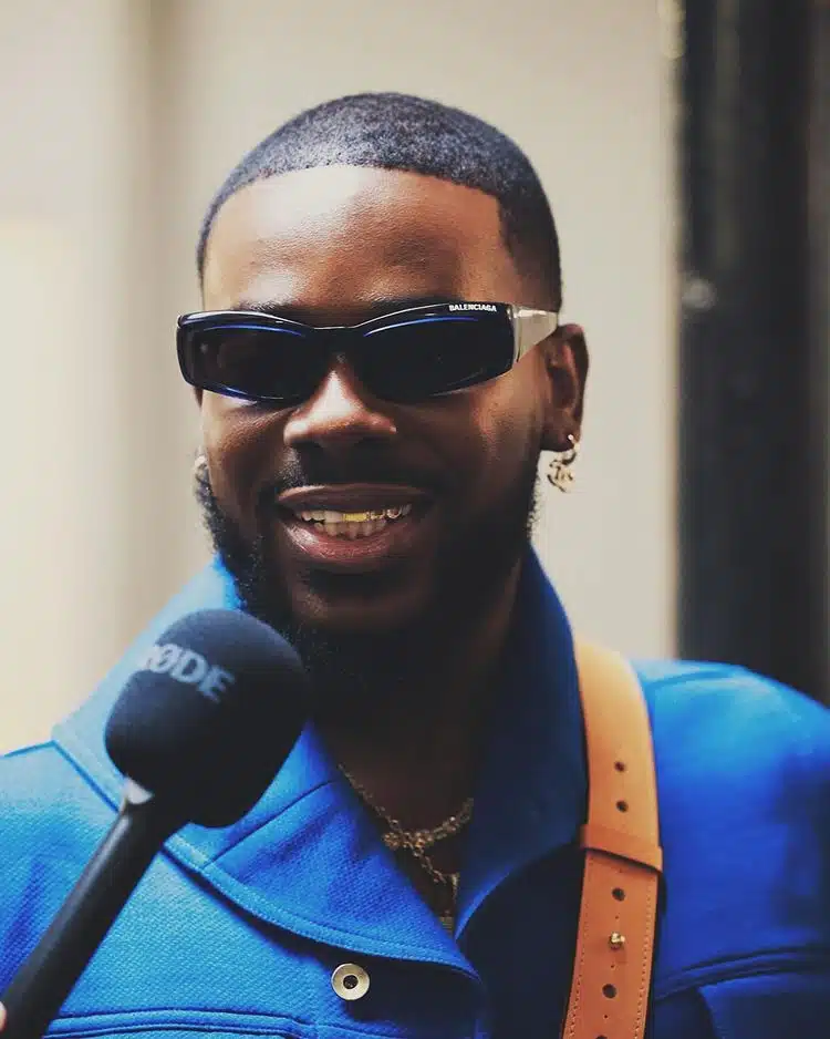 Adekunle Gold floors fan who asked “who is richer between he and Simi?”