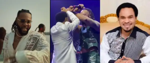 Fans React As Flavour And Odumeje Show Unusual Hand Sign On Stage