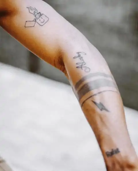Who Can Guess The Nigerian Artiste With This Tattoo? (98% Will Guess Wrongly)