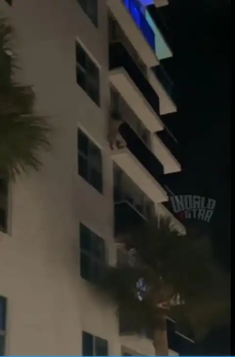 Drama As Side Chick Climbs Down Five Floors From Man's Balcony After His Main Girl Showed Up Unannounced (Video)