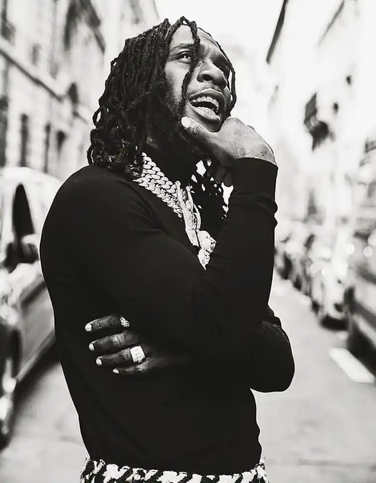 Burna Boy pulls up in his Ferrari to gift ‘area boys’ thousands of Naira (Video)