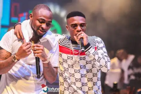 Drama As Die-hard Fans Trade Blows As Wizkid VS Davido Argument Escalates (Video)