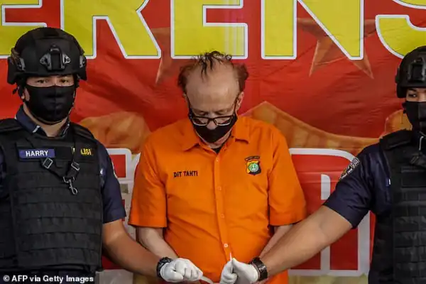 French paedophile who faced death by firing squad kills himself in prison after being accused of molesting 300 children in Indonesia