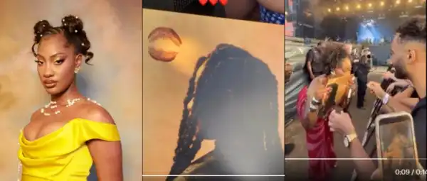Tems’ Sweet Gesture Goes Viral As She Kisses Fan’s Art After Pen Stops Working