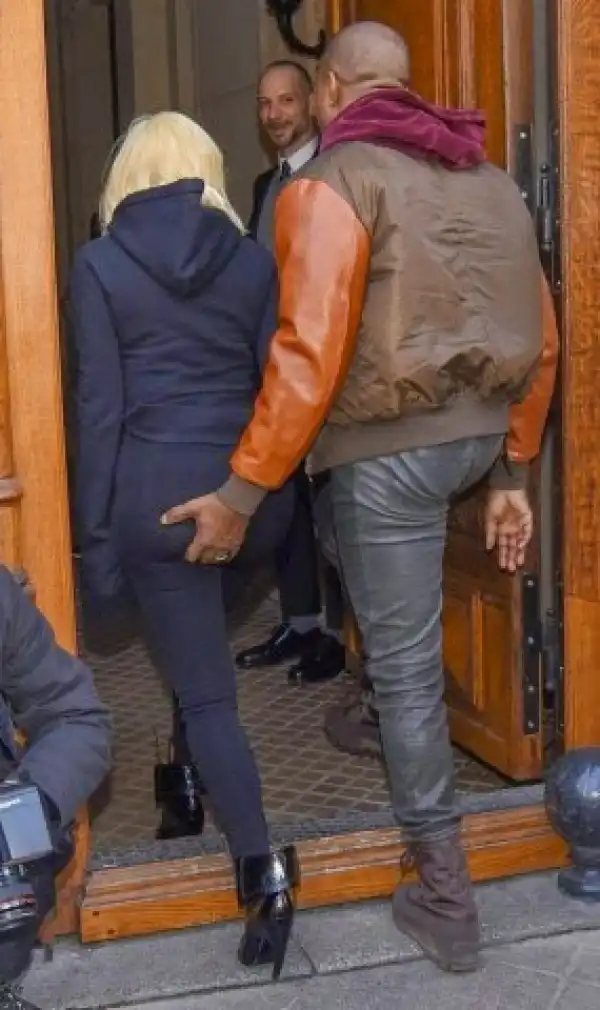 Kanye grabs Kim
