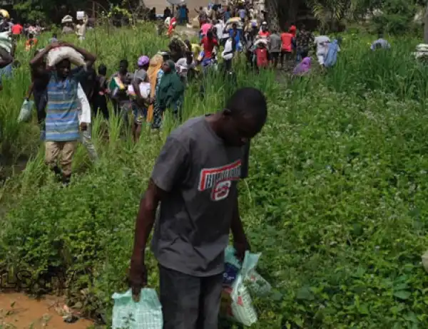 Mob invade and cart away alleged COVID-19 palliatives from Gwagalada warehouse (video)