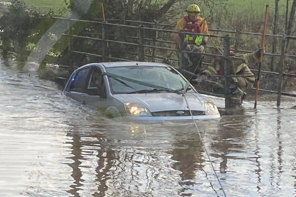 Woman, child rescued from flooded car in Shropshire