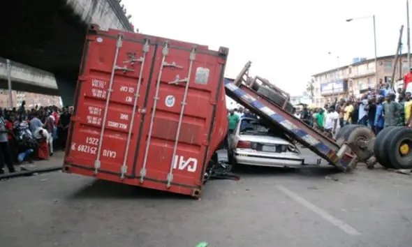 Container collapses on car in Lagos, driver rescued