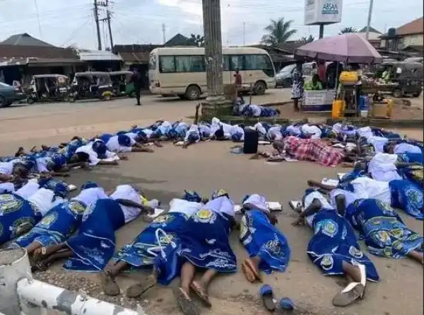 Group Of Church Women Seen Lying On The Road In Umuahia Praying To God For Good Leaders (Video)