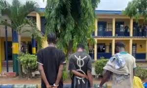 Police parade three suspects with human skull in Imo