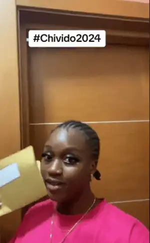 Young lady over the moon as she receives official IV for Davido’s wedding with her name on it