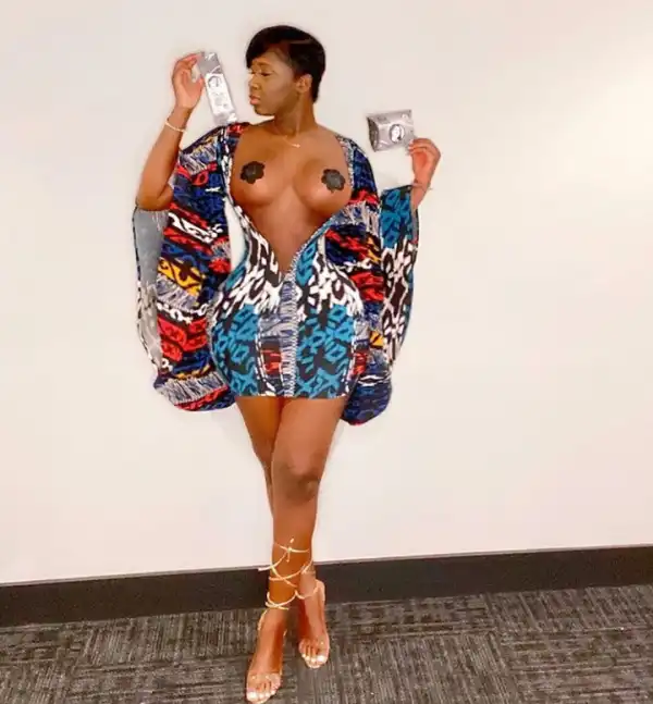 Princess Shyngle exposes her bare breasts in a dress with a plunging neckline