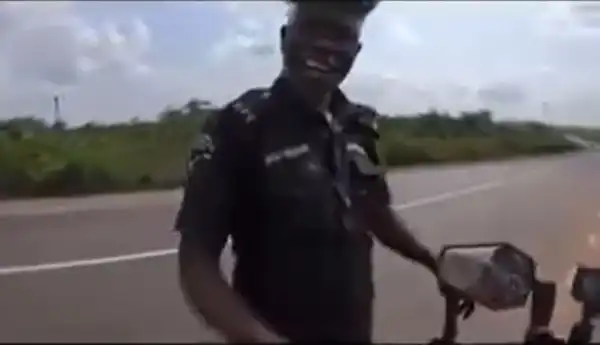 Police Officers Caught On Camera Begging Foreign Female Biker for Money (Video)