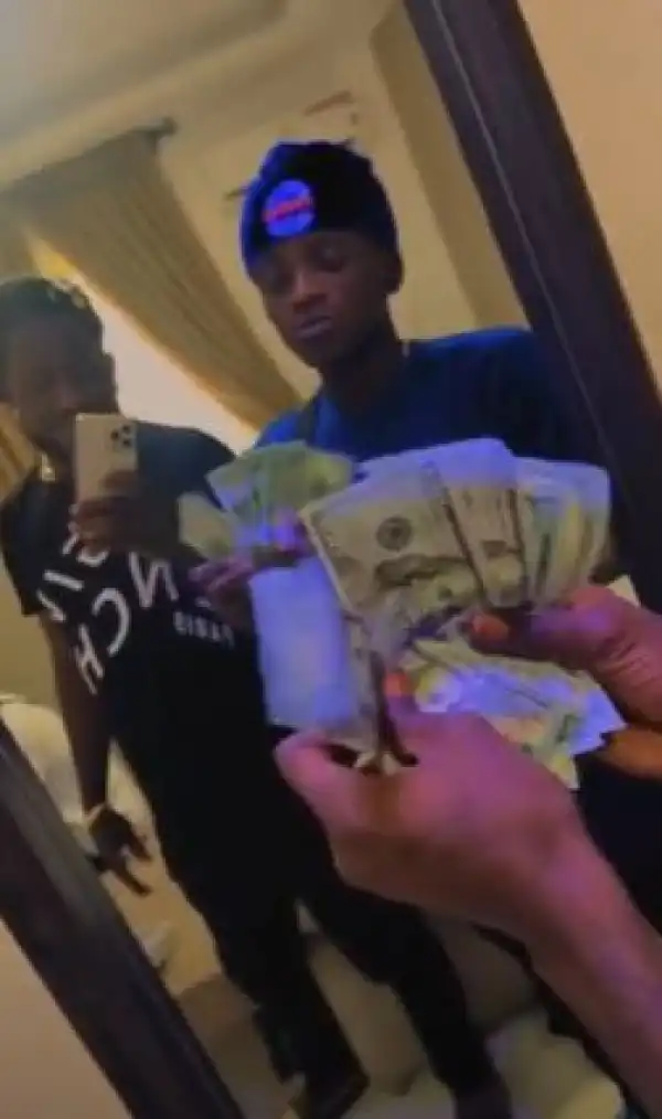 Singer Portable Flaunts Dollar Bills Given to Him by Davido (Video)